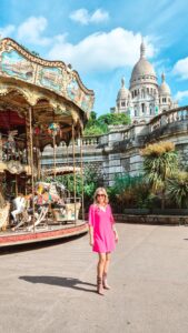 Standing in front of the carousel with the sacre coeur in the background